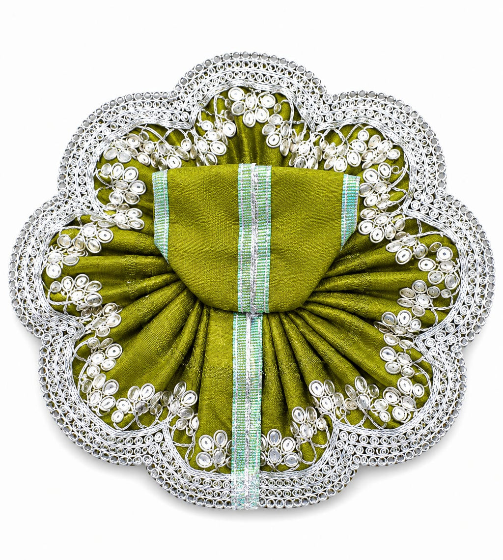 Decorative green fabric brooch with pearl embellishments on a white background